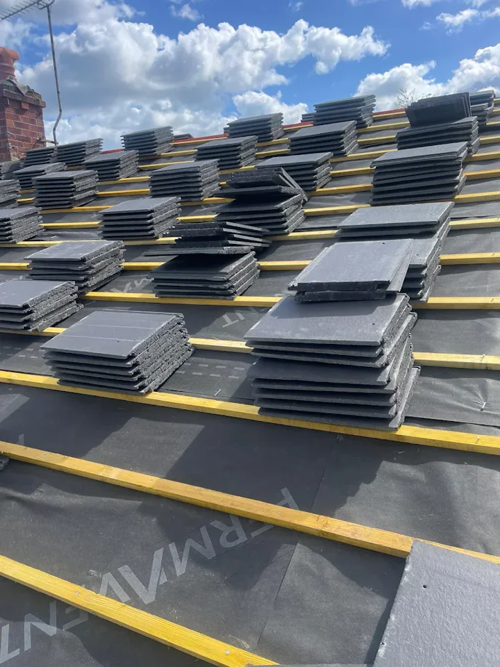 Roof tiles staged for installation — supplied photograph