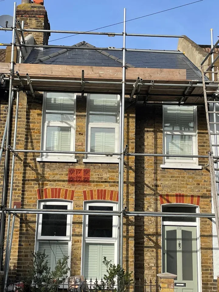 Slate roof behind access scaffolding — supplied photograph