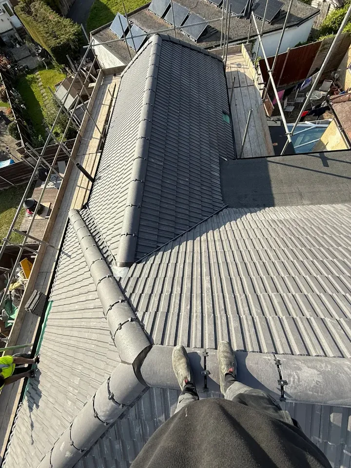 Tiled roof junction and ridge — supplied photograph