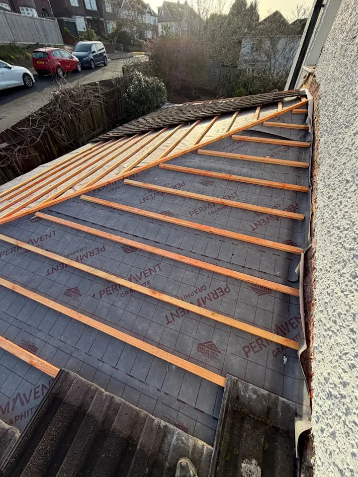 Roof membrane and battens beside a house — supplied photograph