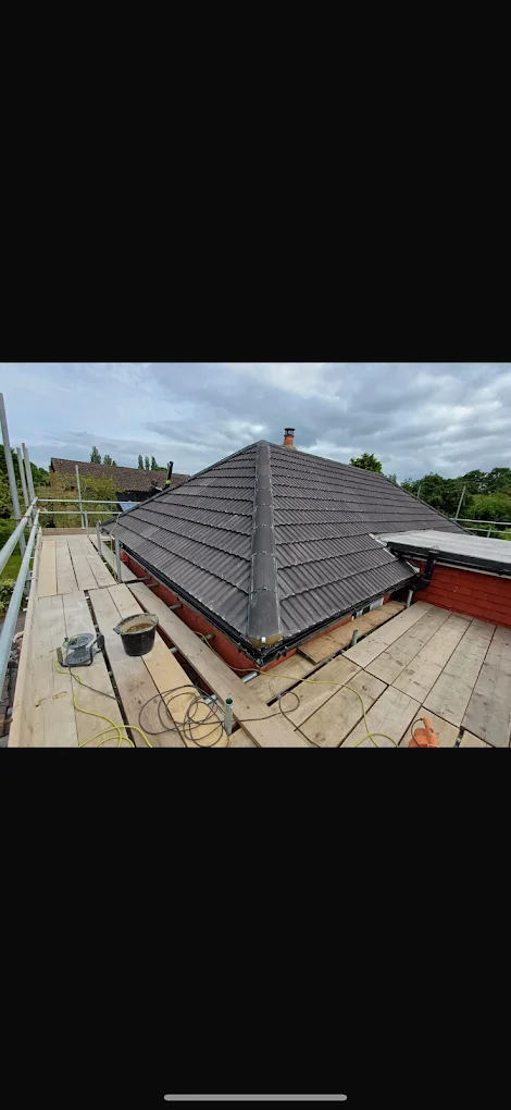 Hipped tiled roof with scaffold access — supplied photograph